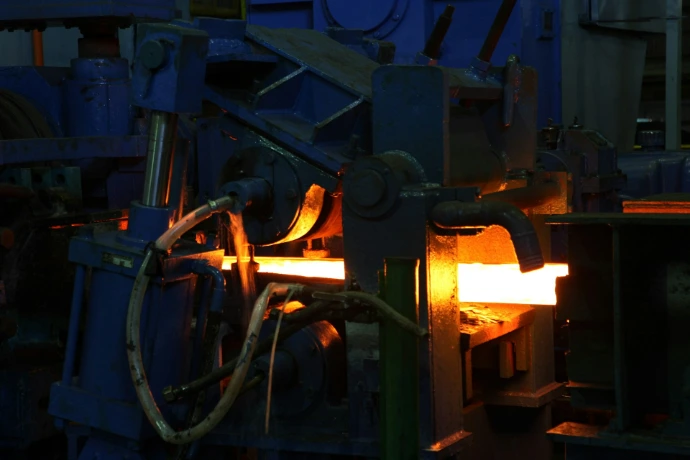 A man working on a machine in a factory